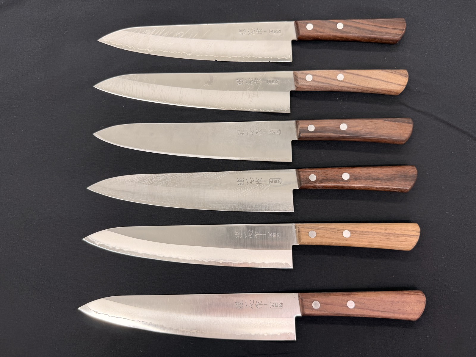 Cutting paper with each resharpened knife to compare sharpness